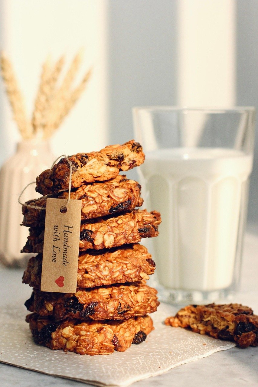 Close-up image of a nut and sesame seed protein bar on parchment paper, ideal for healthy snacking.
