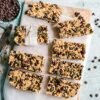 pexels-photo-3026806-3026806 Top view of homemade granola bars with seeds and chocolate chips.