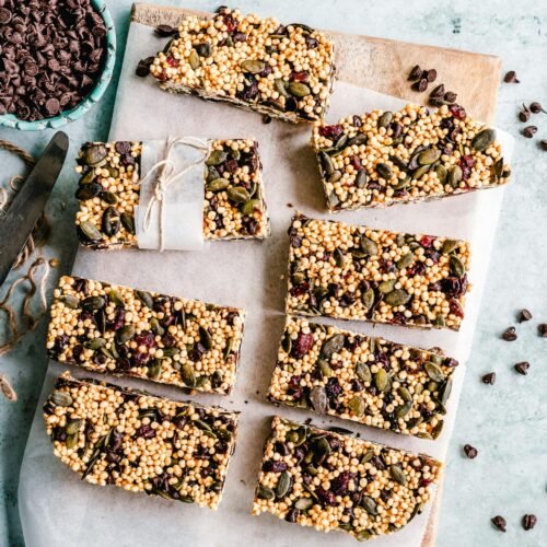 pexels-photo-3026806-3026806 Top view of homemade granola bars with seeds and chocolate chips.