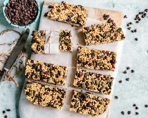 pexels-photo-3026806-3026806 Top view of homemade granola bars with seeds and chocolate chips.